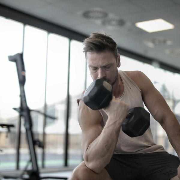 Man in a state of deep concentration during a physical exercise.