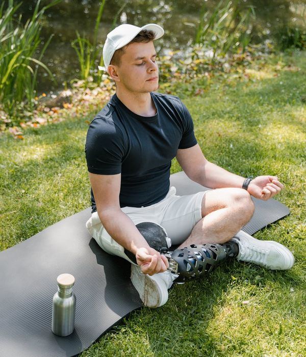 Man performing a strength and balance exercise in a calm, focused environment.